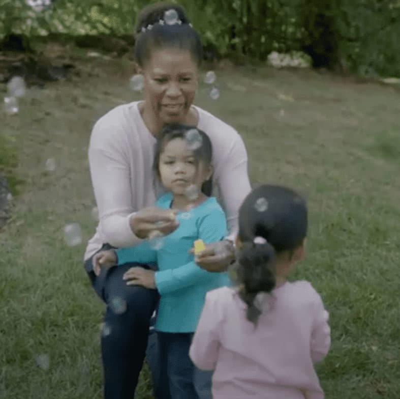 Family blowing bubbles